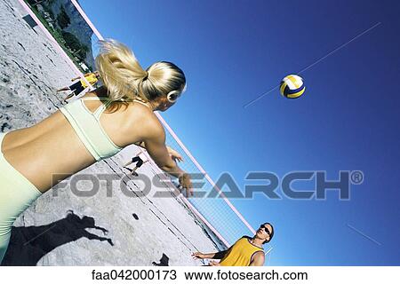 Female preparing to volley ball to teammate View Large Photo Image Stock Image - Female preparing to volley ball to teammate. Fotosearch