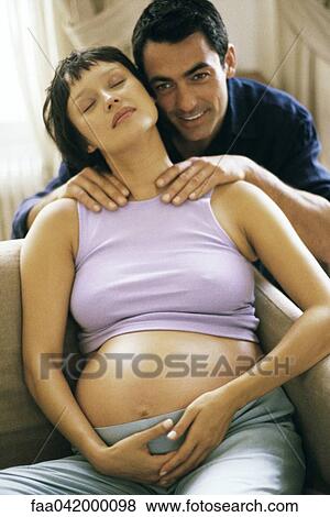 Man massaging pregnant wife's shoulders View Large Photo Image Stock Photo - Man massaging pregnant wife's shoulders. Fotosearch