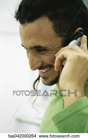 "Man phoning, side view, close-up" View Large Photo Image Picture - "Man phoning, side view, close-up". Fotosearch