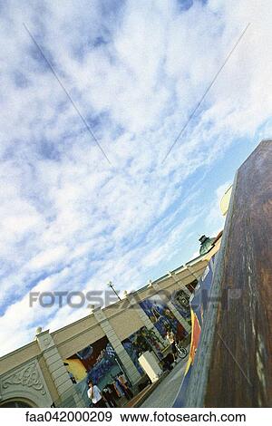 Stock Photo - "Skatepark, building exterior in background painted with murals". Fotosearch