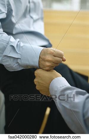 Two men touching fists View Large Photo Image Stock Image - Two men touching fists. Fotosearch