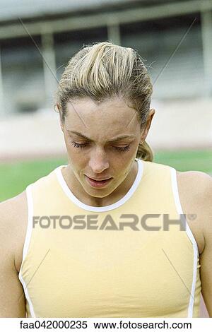Stock Photography - "Woman with head down, close-up". Fotosearch
