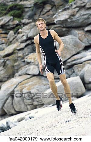 Young man running in place View Large Photo Image Stock Photo - Young man running in place. Fotosearch