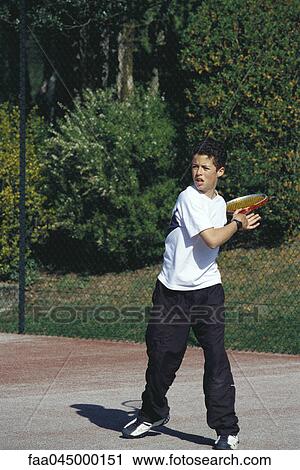 Boy playing tennis View Large Photo Image Stock Image - Boy playing tennis. Fotosearch