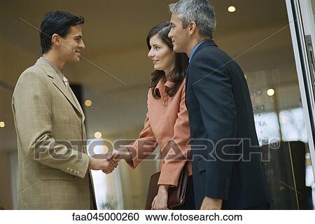 Business associates shaking hands View Large Photo Image Stock Image - Business associates shaking hands. Fotosearch