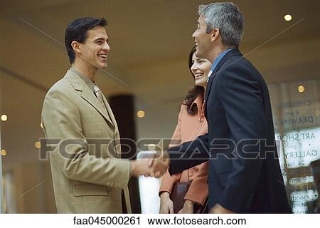 Business associates shaking hands View Large Photo Image Stock Image - Business associates shaking hands. Fotosearch