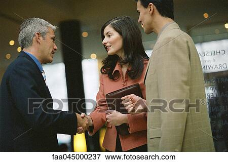 Business associates shaking hands View Large Photo Image Stock Photo - Business associates shaking hands. Fotosearch