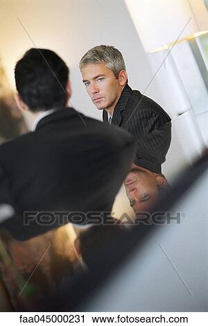 Businessman meeting with associate View Large Photo Image Stock Image - Businessman meeting with associate. Fotosearch