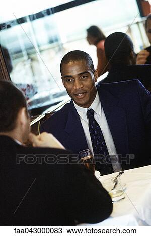Businessmen together in restaurant View Large Photo Image Stock Image - Businessmen together in restaurant. Fotosearch