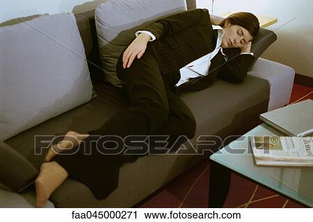 Businesswoman fully clothed sleeping on sofa View Large Photo Image Stock Image - Businesswoman fully clothed sleeping on sofa. Fotosearch
