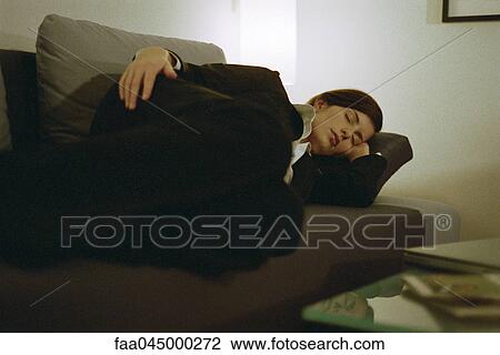 Businesswoman fully clothed sleeping on sofa View Large Photo Image Stock Image - Businesswoman fully clothed sleeping on sofa. Fotosearch