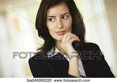 Businesswoman looking away in thought, portrait View Large Photo Image Stock Image - Businesswoman looking away in thought, portrait. Fotosearch