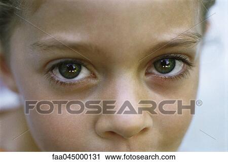 Stock Image - Child's face, close-up. Fotosearch