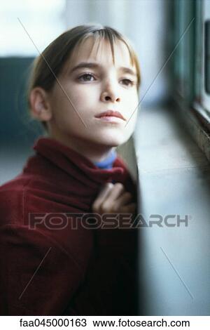 Girl looking out window View Large Photo Image Stock Image - Girl looking out window. Fotosearch