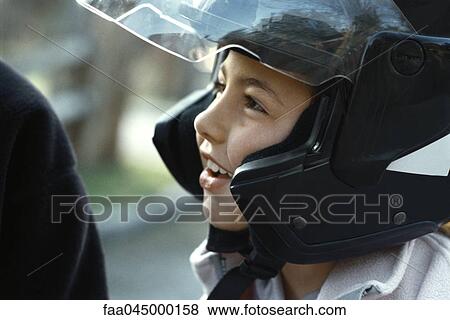 Girl wearing motorcycle helmet View Large Photo Image Stock Photo - Girl wearing motorcycle helmet. Fotosearch
