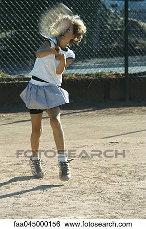 Little girl playing tennis View Large Photo Image Stock Photograph - Little girl playing tennis. Fotosearch