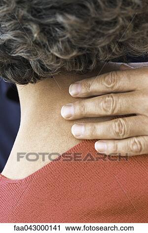 Man's hand on back of woman's neck, close-up View Large Photo Image Stock Image - Man's hand on back of woman's neck, close-up. Fotosearch
