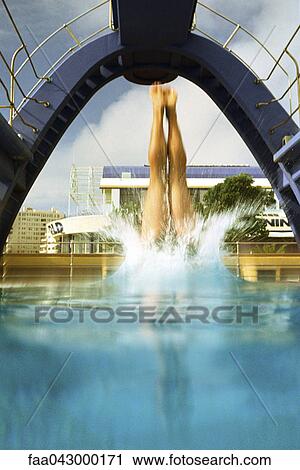 Person diving into pool, surface level view View Large Photo Image Stock Image - Person diving into pool, surface level view. Fotosearch