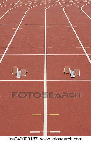 Starting blocks on running track View Large Photo Image Stock Photo - Starting blocks on running track. Fotosearch