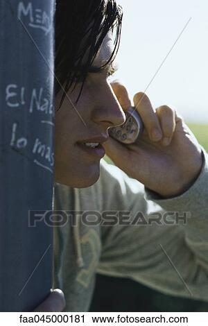 Teenager using cell phone View Large Photo Image Stock Image - Teenager using cell phone. Fotosearch