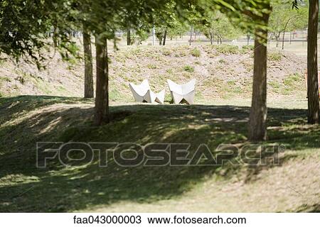 Two lounge chairs in sunny corner of park View Large Photo Image Stock Image - Two lounge chairs in sunny corner of park. Fotosearch