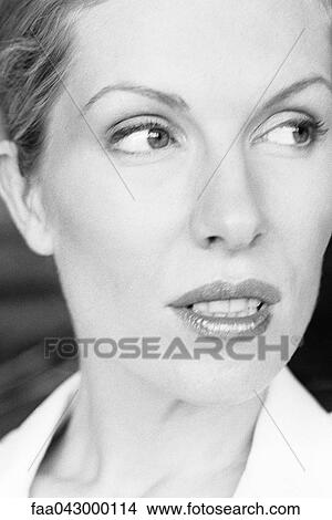 Woman glancing sideways, portrait View Large Photo Image Picture - Woman glancing sideways, portrait. Fotosearch