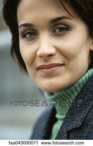 Stock Image - Woman looking with confidence at camera. Fotosearch