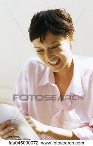 Stock Image - Woman reading book. Fotosearch