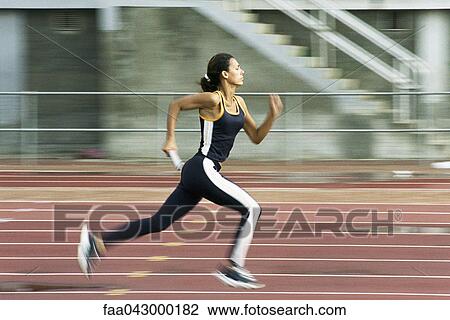 Woman running on track View Large Photo Image Stock Image - Woman running on track. Fotosearch