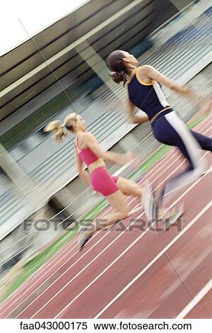 Woman running on track View Large Photo Image Stock Photography - Woman running on track. Fotosearch