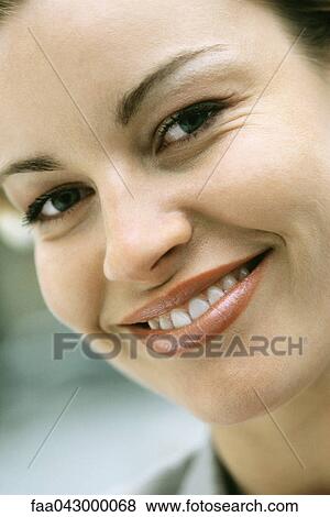 Stock Photo - Woman smiling at camera, portrait. Fotosearch