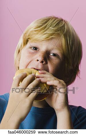 Boy eating sandwich View Large Photo Image Stock Photo - Boy eating sandwich. Fotosearch