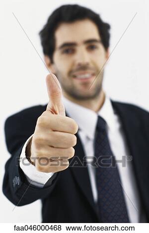 Businessman giving thumbs up View Large Photo Image Stock Photo - Businessman giving thumbs up. Fotosearch
