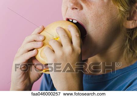 Child eating ham and cheese sandwich View Large Photo Image Stock Photo - Child eating ham and cheese sandwich. Fotosearch