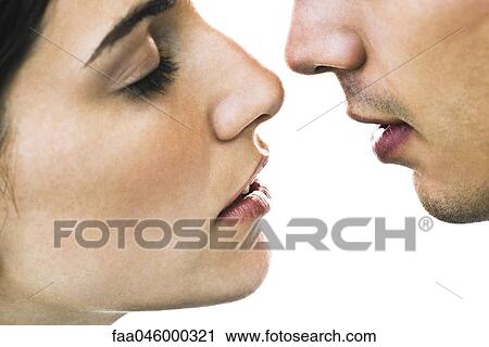 Stock Image - Couple about to kiss, close-up. Fotosearch