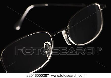 Eyeglasses on black background View Large Photo Image Stock Photo - Eyeglasses on black background. Fotosearch