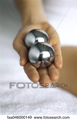 Hand holding up pair of yin yang balls View Large Photo Image Stock Photo - Hand holding up pair of yin yang balls. Fotosearch