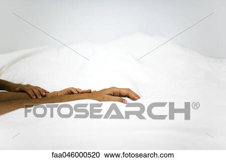 Hands touching on comforter View Large Photo Image Stock Image - Hands touching on comforter. Fotosearch