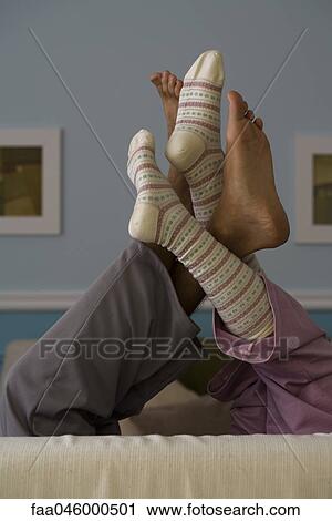 Legs raised, intertwined View Large Photo Image Stock Image - Legs raised, intertwined. Fotosearch