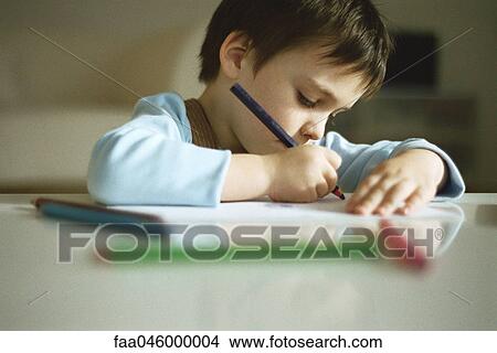 Little boy concentrating on drawing View Large Photo Image Picture - Little boy concentrating on drawing. Fotosearch