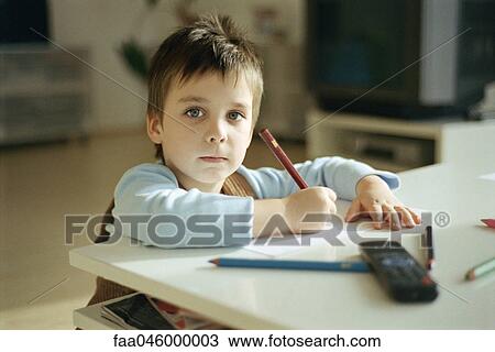 Little boy drawing, pausing to look at camera View Large Photo Image Stock Image - Little boy drawing, pausing to look at camera. Fotosearch