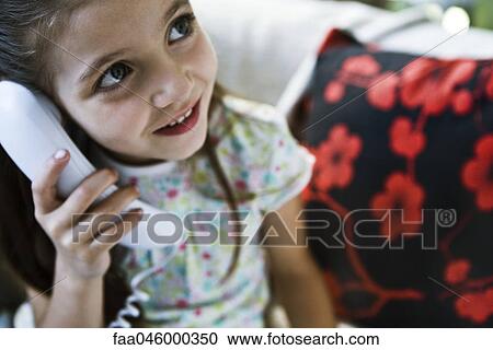 Little girl using landline phone View Large Photo Image Stock Image - Little girl using landline phone. Fotosearch