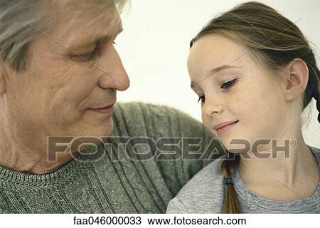 Stock Image - Little girl with grandfather, portrait. Fotosearch