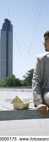 Man contemplating skyscraper in distance, miniature wooden model house at side View Large Photo Image Stock Photography - Man contemplating skyscraper in distance, miniature wooden model house at side. Fotosearch