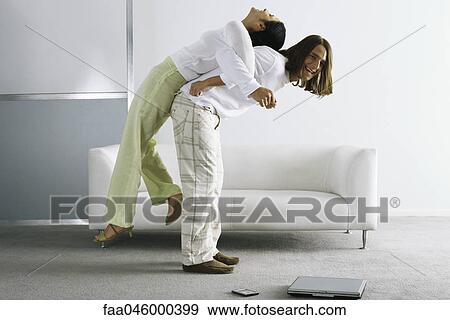 Man lifting woman on back View Large Photo Image Stock Photo - Man lifting woman on back. Fotosearch