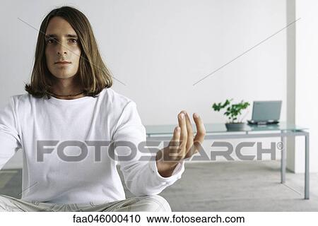 Man sitting in lotus position View Large Photo Image Stock Image - Man sitting in lotus position. Fotosearch