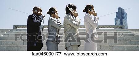 Stock Photo - Professionally dressed men and women in line using successively more advanced phones. Fotosearch