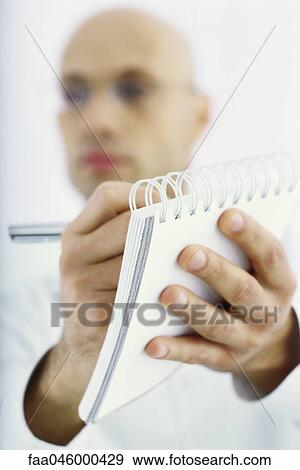 Researcher taking notes View Large Photo Image Stock Photo - Researcher taking notes. Fotosearch