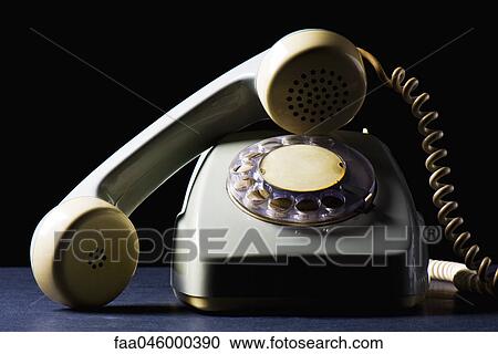 Rotary telephone with receiver off the hook, still life View Large Photo Image Stock Image - Rotary telephone with receiver off the hook, still life. Fotosearch