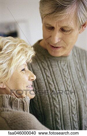 Stock Image - Senior couple in conversation. Fotosearch